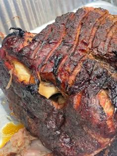 a large piece of meat sitting on top of a pan