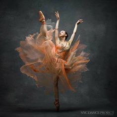 a ballerina in an orange dress is dancing with her arms stretched out to the side