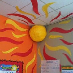 the sun is painted on the wall in an office