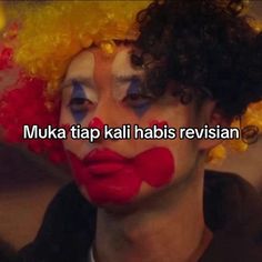 a man with clown makeup and hair has words written on his face that read muka tap kalli habi revisian