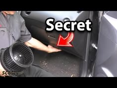 a man opening the door of a car with an air conditioner on his hand