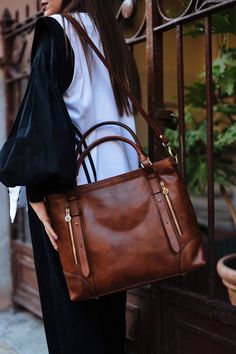 "This Brown cowhide leather bag is 100% handmade. this large tote bag is suitable for carrying everything in your everyday life. It has a Zipper Closure and Cross Body Strap The bag has a cotton lining and it has several inner and outter pockets. As you can see it made by really high-quality Italian leather.this leather calls \"Pelle Conciata Al Vegetale\", which means that the leather is tanned with only natural materials. Interior fully lined with cotton and easy to clean The bag comes with a Elegant Leather Weekender Bag With Zipper, Elegant Large Capacity Brown Weekender Bag, Elegant Brown Large Capacity Weekender Bag, Elegant Brown Weekender Shoulder Bag, Elegant Brown Shoulder Weekender Bag, Elegant Soft Leather Brown Weekender Bag, Elegant Brown Soft Leather Weekender Bag, Natural Materials Interior, Leather Bag Handmade