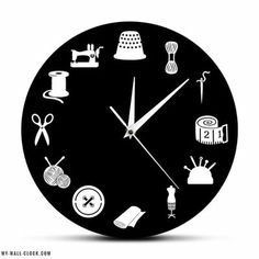 a black and white clock with sewing related items