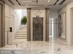 an empty lobby with marble flooring and stairs leading up to the second story door