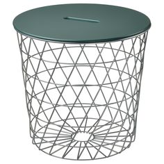 a round metal side table with a green top and geometric design on the bottom,