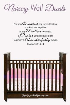 a baby crib with the words nursery wall decals in purple and pink on it