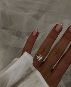 a woman's hand with a ring on it