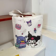 Step into a world of adorable charm with our Kawaii Cartoon Sanrio Character Print Tote Bag, the ultimate accessory for any anime enthusiast or lover of all things cute. This canvas bag features vibrant and delightful Sanrio characters that will bring joy to your everyday errands, making it not just a tote but a statement piece that stands out in any crowd. Japanese Harajuku, All Things Cute