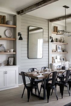 A modern farmhouse dining room featuring a shiplap accent wall with rustic wood beams and industrial decor elements. Farmhouse Dining Room Accent Wall, Modern Farmhouse Dining Room, Room Accent Wall, Modern Farmhouse Dining