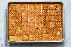 crackers are arranged on top of each other in a baking pan, ready to go into the oven