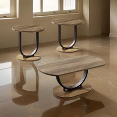 three tables sitting on top of a marble floor next to two windows with sunlight streaming through them