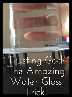 a person holding a glass with water in it and the words trusting god the amazing water glass trick