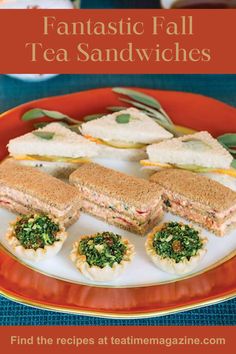 an orange plate topped with sandwiches on top of a table