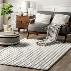 a living room filled with furniture and a rug