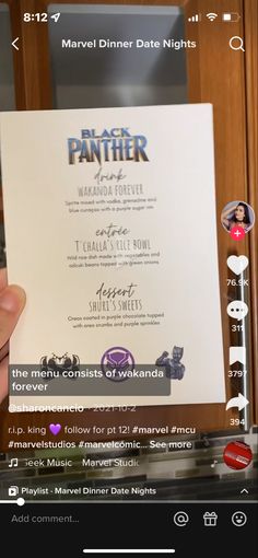 someone is holding up a black panther menu