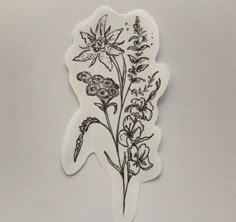 a white sticker with flowers on it