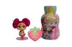 littlest pet shop doll next to a pink bottle with a heart shaped decoration on it