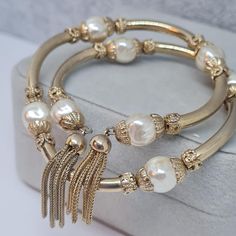 Vintage two-strand memory wire bracelet. Gold-tone metal with white faux pearls beads and chain tassels wrap coil bracelet. Bracelet length: 18 cm/7 inches. Mark- unsigned (Miriam Haskell?). Condition- perfect vintage. Maybe you want to see other bracelets too: https://www.etsy.com/shop/VintageVoyageLT?ref=seller-platform-mcnav&section_id=32036696 You can write me a message if you have any questions. Glad you visited my store! Have a great time! Beaded Memory Wire Bracelets, Beaded Memory Wire, Wire Bracelets, Coil Bracelet, Memory Wire Bracelet, Miriam Haskell, Vintage Memory, Memory Wire Bracelets, Wedding Jewelry Bracelets