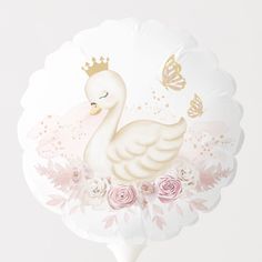 a paper plate with a swan and roses on it