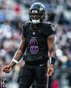 a football player in uniform standing on the field