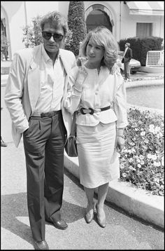 black and white photograph of man and woman walking together