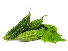 two green gourds with leaves on a white background