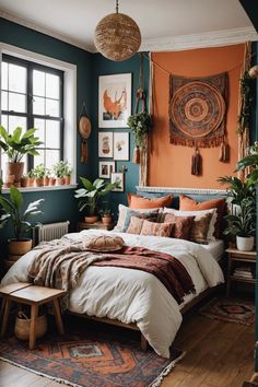 a bedroom with an orange wall and lots of potted plants