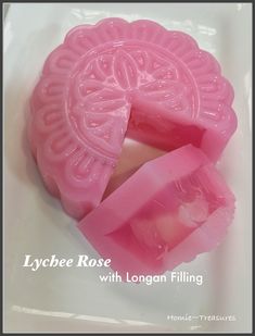 a close up of a waxed object on a white surface with the words lychbee rose with longan filling