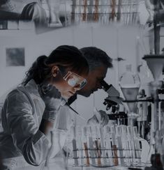 a man and woman in lab coats working together