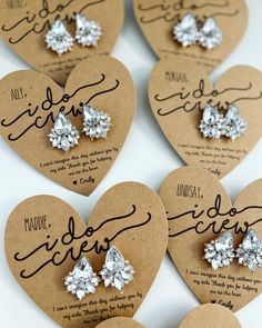 six heart shaped brooches with diamond earrings on them