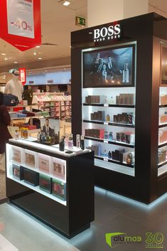 a display case in a store filled with lots of products and people looking at it