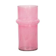 a pink vase sitting on top of a white table