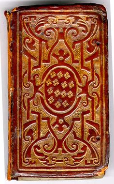 an old book with intricate designs on it