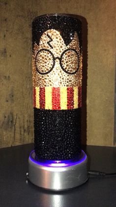 a harry potter lamp with glasses on it