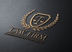 the law firm logo is shown on a black surface with gold foil and laurels