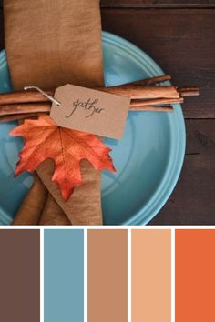 a blue plate topped with an orange and brown leaf next to a tag that says fall