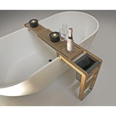 a bathtub with candles and bottles on it