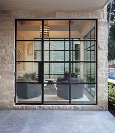 an open glass door leading into a living room