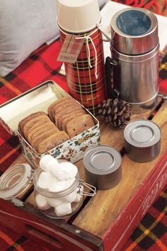 an assortment of food on a table with jars and containers next to eachother