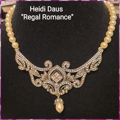 Heidi Daus "Regal Romance" Simulated Pearl Drop Necklace. This Piece Was Made From A Single-Strand Pearl With Tiara Drop Crystallized Swarovski And A Diamond-Shaped Center. It's A Classic Heirloom Best Quality From Manufacturer Heidi Daus Known For Its Unique Jewelry. The Set Includes A Necklace And Earrings/ Price Is A Steal. Manufacturer Lifetime Limited Warranty. Pearl Drop Necklace, Heidi Daus, Diamond Shaped, Necklace And Earrings, Drop Necklace, Pearl Drop, Cream White, Diamond Shapes, Tiara