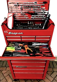 a red tool box with tools in it