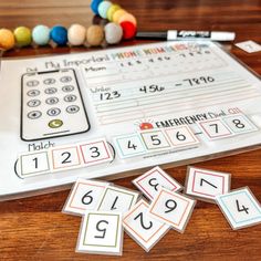 a table with numbers and place cards on it, including one for the number line