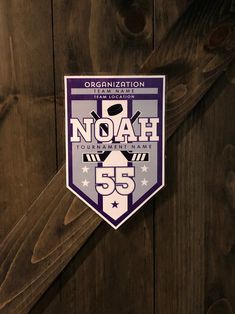 a sticker on the side of a wooden door that says noah tournament 55