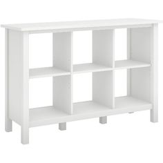 a white bookcase with four shelves on each side