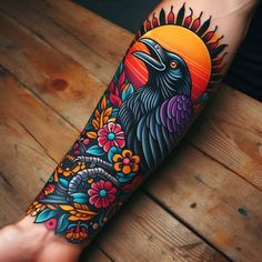 a person with a colorful tattoo on their arm and leg, holding a bird in front of the sun