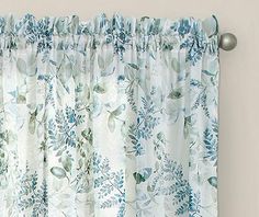 a curtain with blue and white flowers on it