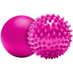 a pink ball with spikes on it next to a purple object