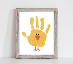 a hand print with a yellow chicken on it