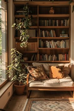 a living room filled with lots of books and plants