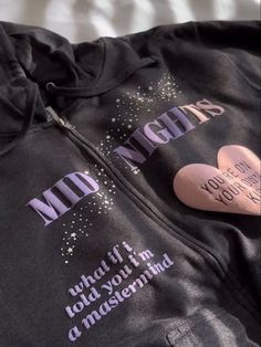 a black hoodie with pink hearts on it and words written on the side that says,'i love you to the moon and back '